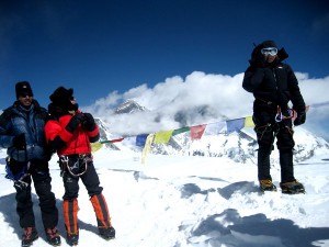 Climber happy to be at the top of Ama Dablam, sharing news back home by sattelite phone. 